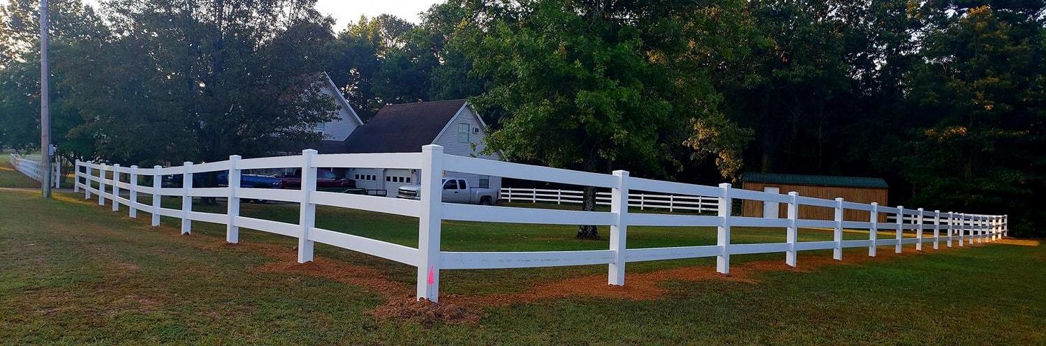 White ranch-style residential fence 